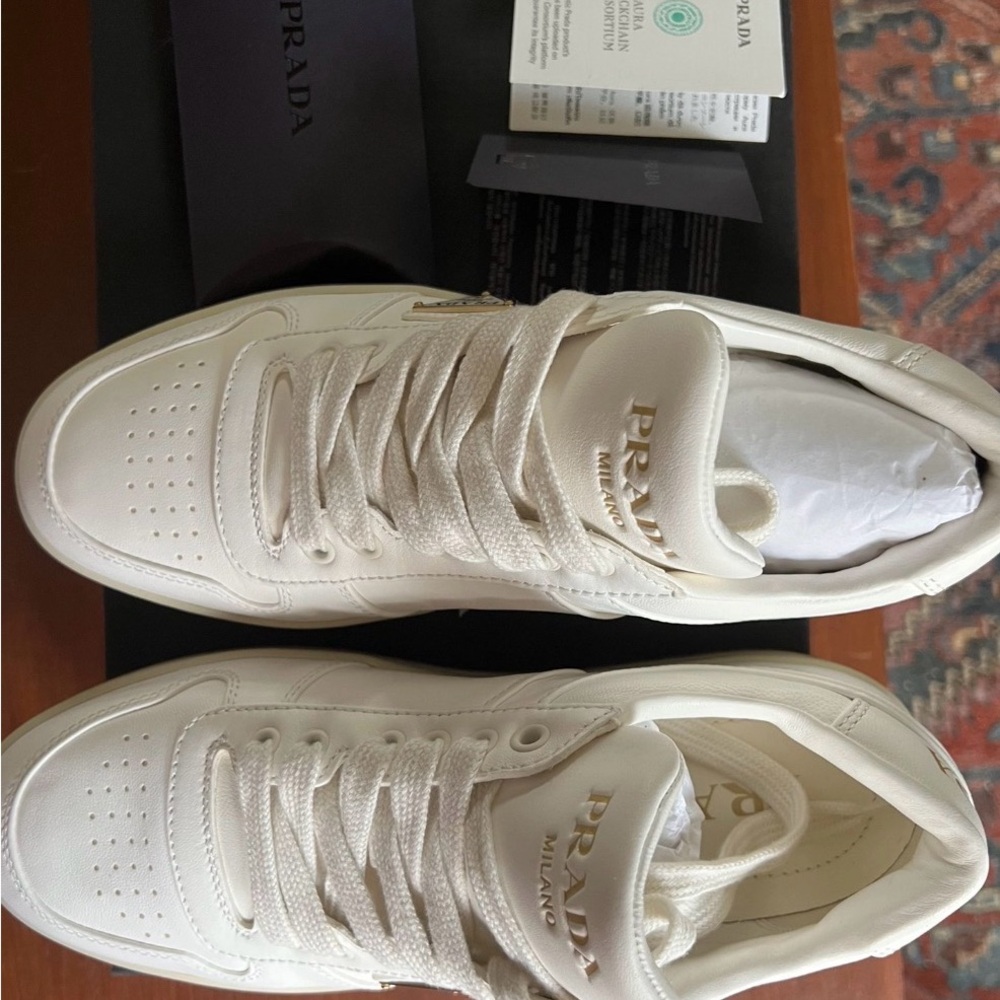 Prada Women’s Cream Leather Low-Top Sneakers with Gold Logo - Picture 2 of 8